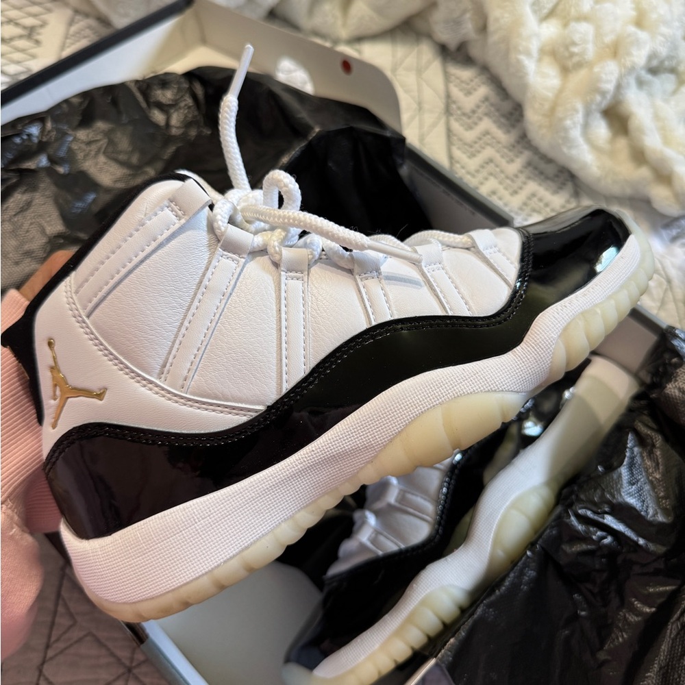 Jordan 11 Retro White and Metallic Gold Sneakers